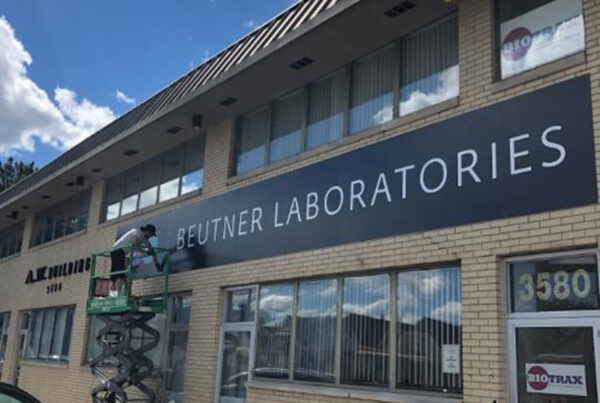 Photo of Beyond Print Solutions installing Beutner Laboratories exterior signage