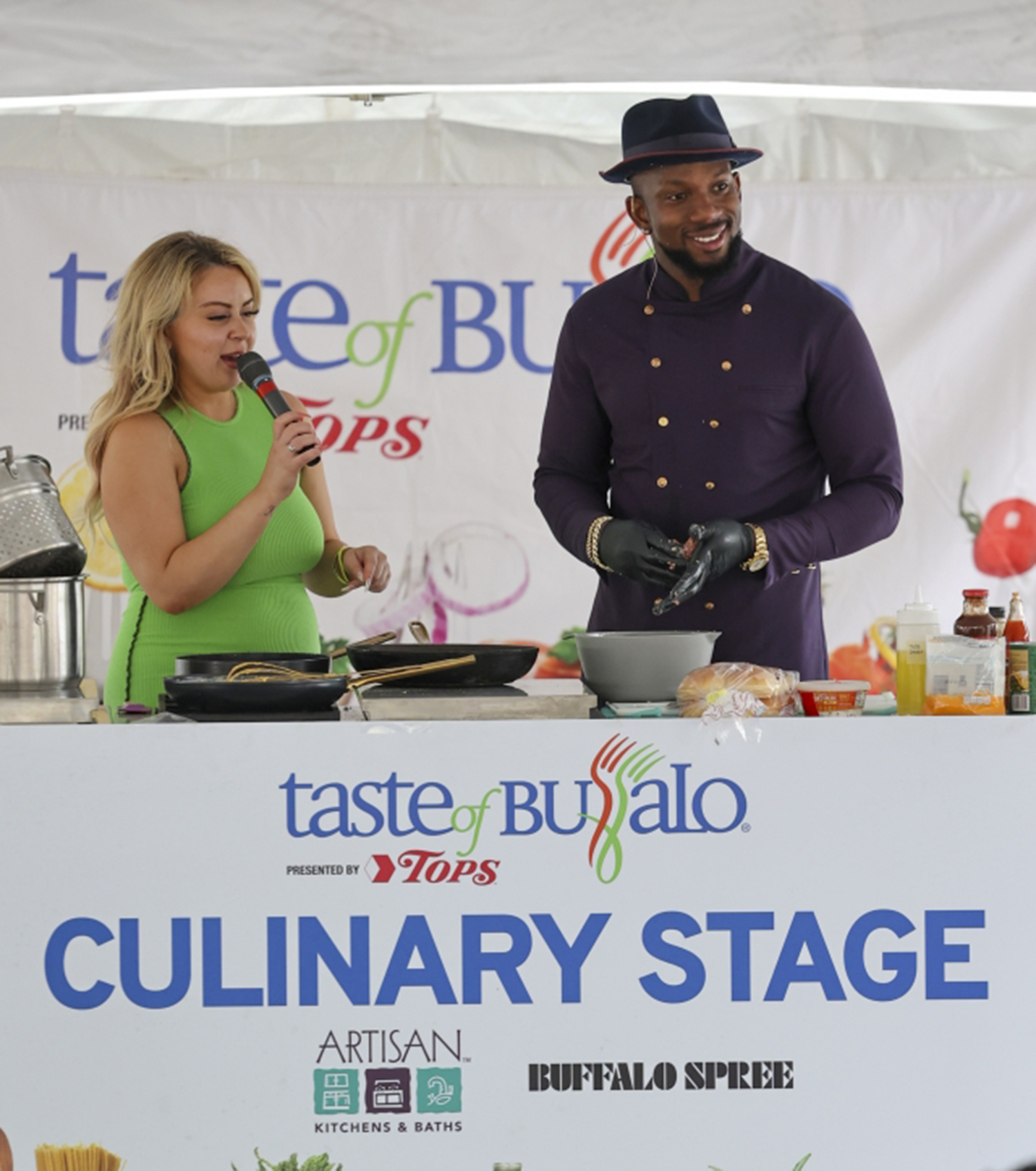 Photo of chef darian bryan cooking with taste of buffalo signage printed by beyond print solutions